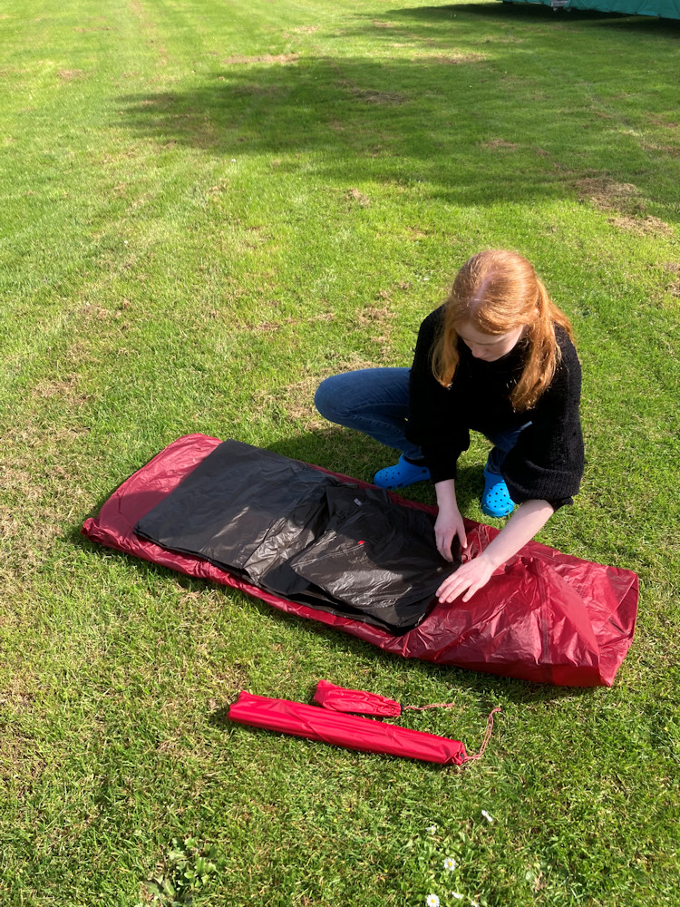 Elena unpacking her tent