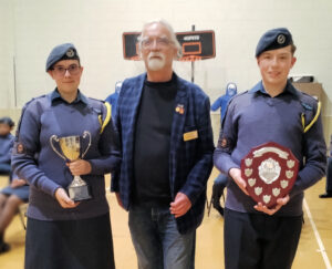 Chas Bedford presents trophies to cadets who participated in the North Downs Walk